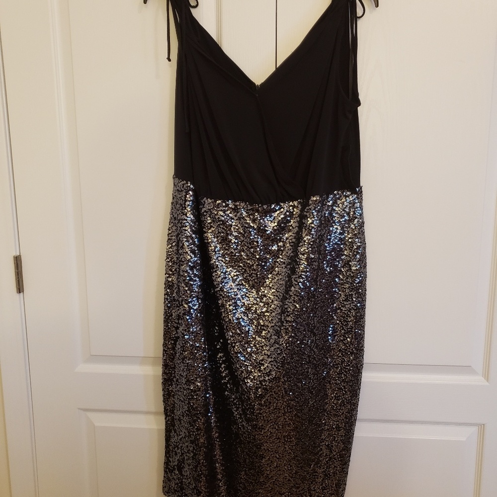 Black dress with a plunge bodice and sequin skirt